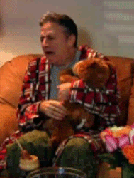 Jon-Stewart-Crying-With-His-Teddy-Bear-Gif.gif