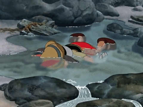 Disneys-Pinocchio-Quits-Life-Sleeps-In-a-Puddle.gif