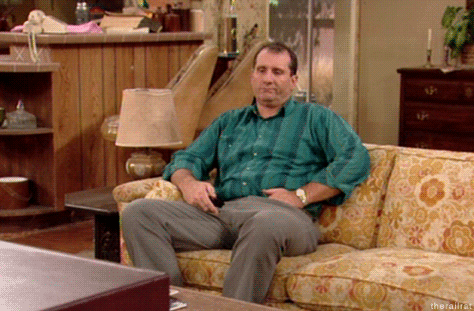 Al-Bundy-Bored-At-Home-Switching-The-TV-Channel-On-Married-With-Children.gif