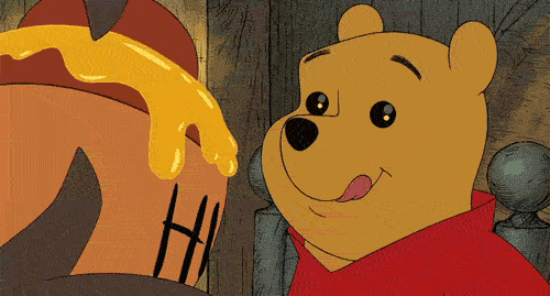 Winnie-The-Pooh-Is-Mesmerized-By-The-Honey-Gushing-Out-Of-The-Pot.gif