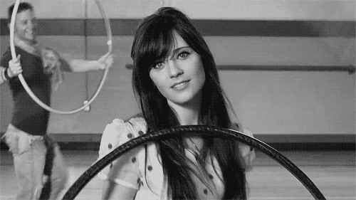 Zoey-Deschanel-Sexy-Wink-With-a-Side-Of-Hula-Hop-Dancing.gif