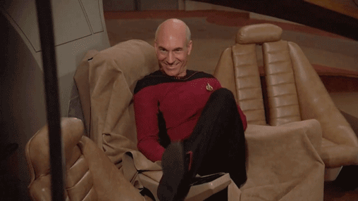 Patrick-Stewart-Shimmies-Wiggles-Smiles-In-The-Captains-Seat-On-Star-Trek.gif