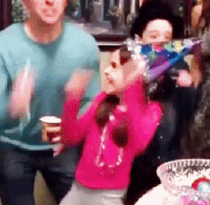 Young-Girl-Breaks-a-Glass-Bowl-When-Getting-Too-Hyped-Up-With-The-Family.gif