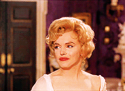 Marilyn-Monroe-Trying-Not-To-Laugh-And-Covering-Her-Mouth.gif