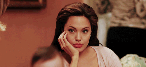 Angelina-Jolie-Looking-Bored-Then-Surprised-In-a-Room-Full-Of-Women.gif